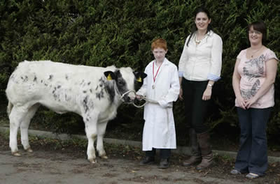 Matthew Edgar junior young handler with Katie Lomas judge and Mandy Herbinson from the meat Joint in Lisburn and Antrim sponsor